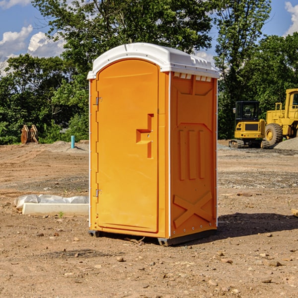 what is the cost difference between standard and deluxe portable restroom rentals in Forgan